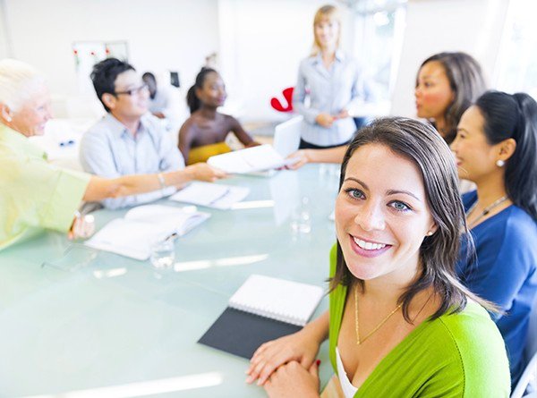 Business woman in conference with associates